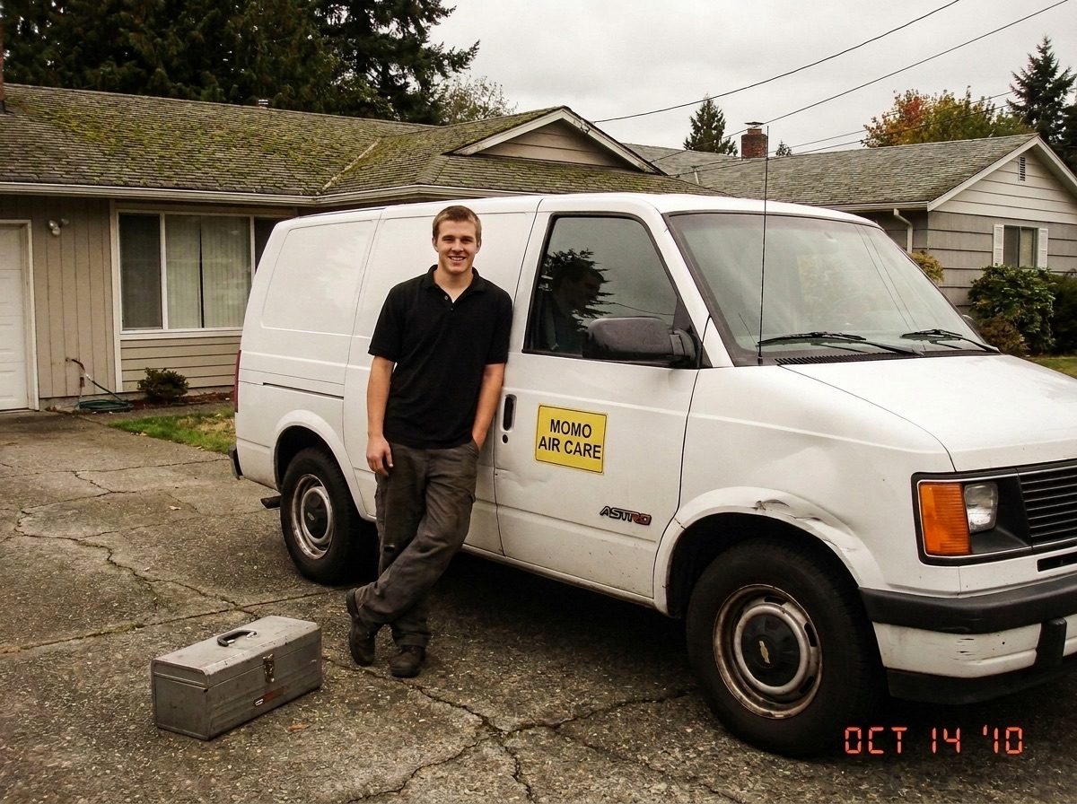 MOMO Air Care's first van and founder in 2010, outside a Seattle-area home